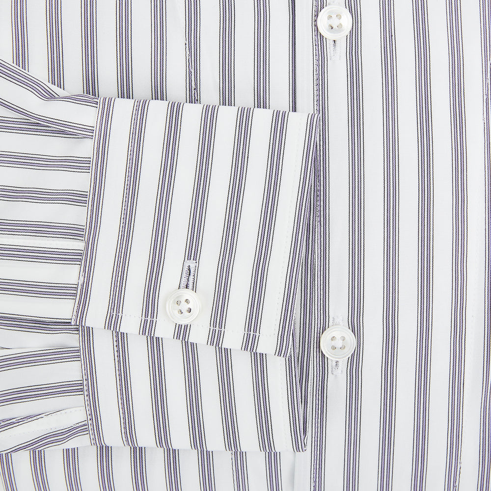 The Turnbull & Asser Purple Multi Stripe Quarzo Nightshirt features a collared, button-front design with a chest pocket and vertical white and light gray stripes, shown laid flat on a white background.