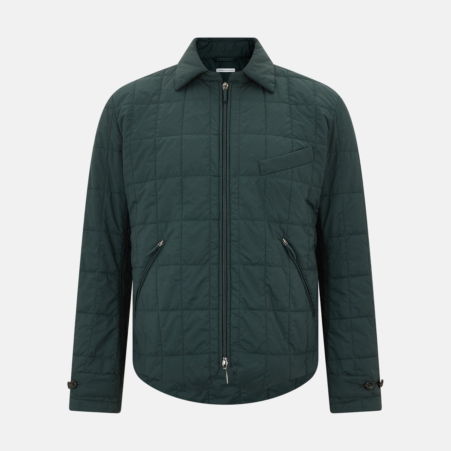 View 1 of product The Turnbull & Asser Battersea Forest Green Quilted Jacket for men features a front zipper, collared neckline, angled chest pocket, two zippered side pockets, and adjustable snap cuffs—shown on a plain white background.