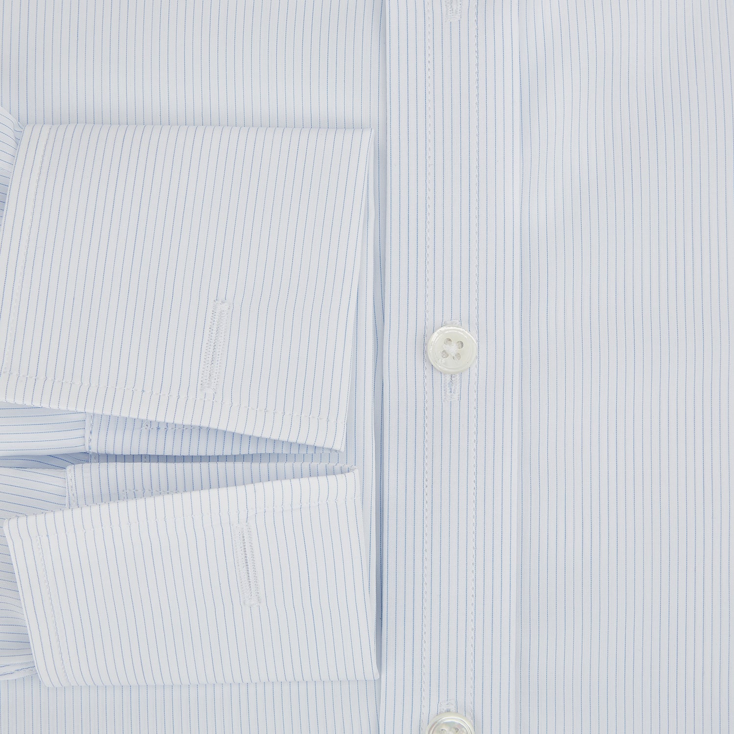 View 4 of product The Turnbull & Asser Blue and White Thin Stripe Shirt features a T&A collar and double cuffs, shown against a plain white background.
