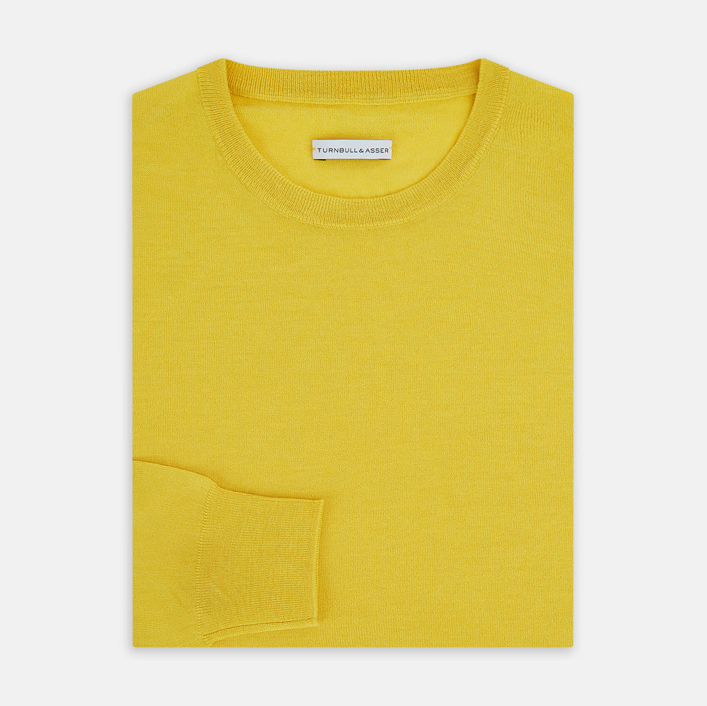 The Turnbull & Asser Canary Yellow Merino Round Neck Jumper features long sleeves and a crew neckline, shown here against a white background.