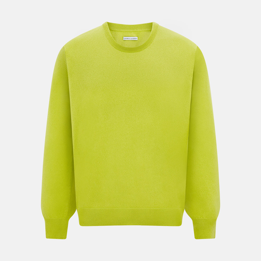 The Turnbull & Asser Lemon Green Cashmere Round Neck Jumper features long sleeves with ribbed cuffs and hem, displayed on a white background.