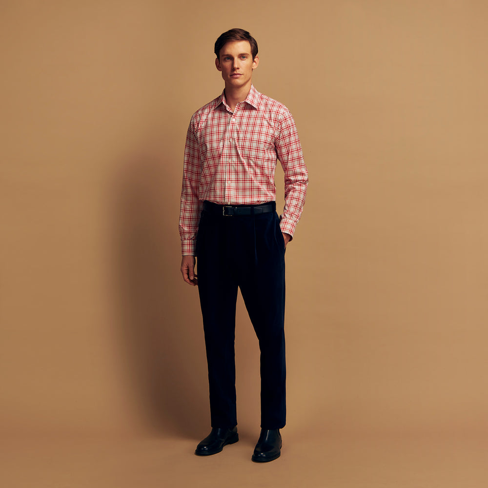 The Turnbull & Asser Red Check Cotton Weekend Fit Finch Shirt is a men's long-sleeved, button-up shirt with a Derby collar and red-and-white plaid pattern, displayed flat on a white background.