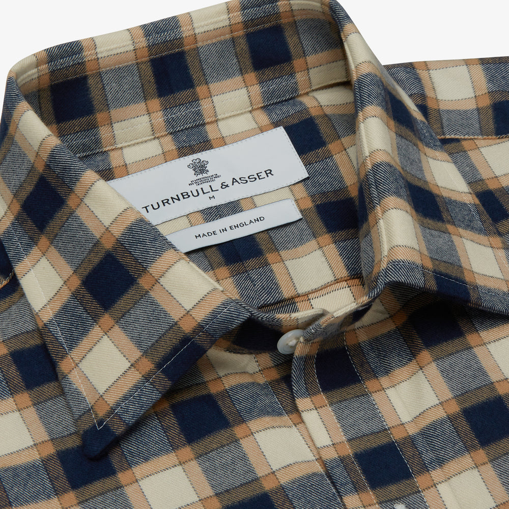 The Turnbull & Asser Blue Multi Check Weekend Fit Shirt features a Derby collar and 1-button cuffs, perfect for winter layering, shown here on a plain white background.