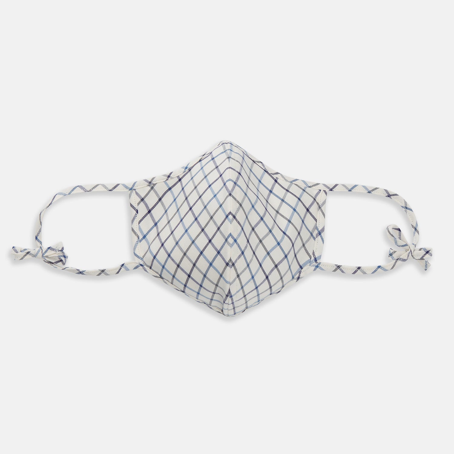View 1 of product The Turnbull & Asser Check Blue Multi Commuter Mask features a blue plaid design, adjustable fabric ear loops tied in bows, and comes with 3 Viroformula™ filters. Laid flat on a white background.