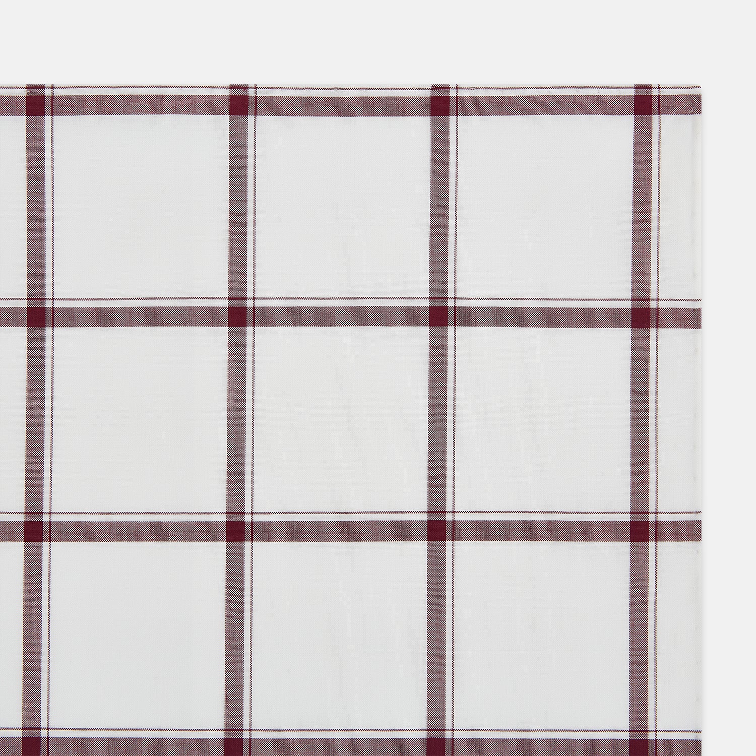 View 2 of product The Turnbull & Asser Burgundy Grid Check Hand-Rolled Handkerchief features a white base with burgundy grid lines forming large squares and is finished with elegant hand-rolled edges.