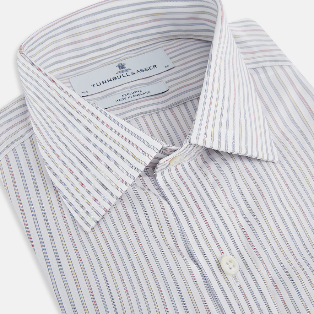 The Turnbull & Asser Multicoloured Music Stripe Mayfair Shirt features thin blue and white vertical stripes, a classic T&A collar, and buttoned cuffs, shown laid flat on a white background.