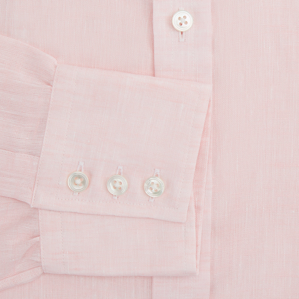 The Turnbull & Asser Pink Linen Shirt features a T&A collar, 3-button cuffs, and classic white buttons. This long-sleeved summer staple is shown on a plain white background.