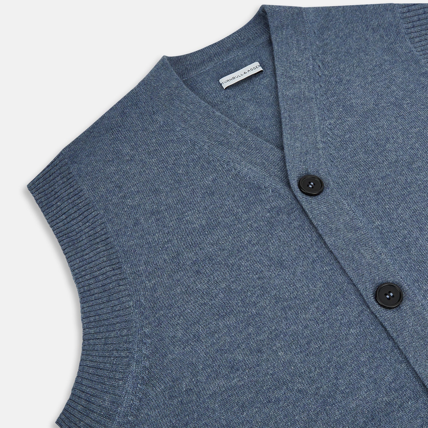 View 2 of product The Blue Melange Cashmere Sleeveless Cardigan by Turnbull & Asser features a V-neck, button-up front, ribbed collar and hem, and two front pockets, shown on a plain white background.
