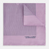 View 1 of product The Lilac Stripe Silk Pocket Square by Turnbull & Asser features thin vertical navy stripes on folded silk, with "TURNBULL & ASSER HAND PRINTED IN ENGLAND" inscribed in the bottom right corner, reflecting British heritage.