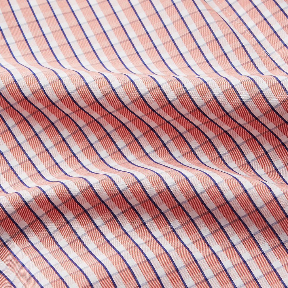 The Turnbull & Asser Orange Multi Check Cotton Arnold Gown features long sleeves, a shawl collar, wrap-around belt, and dark piping on the edges and pocket, displayed flat on a white background.