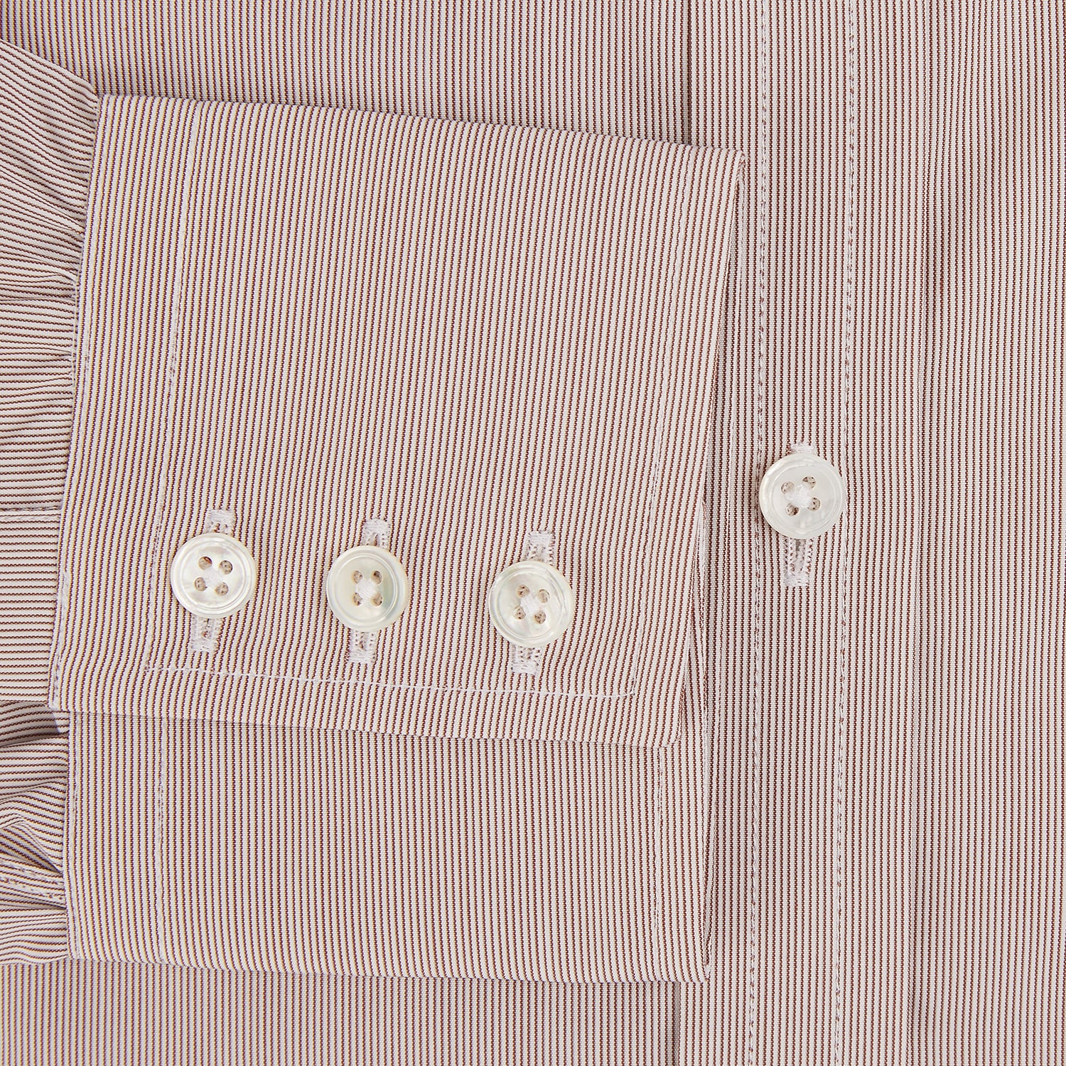 View 4 of product The Turnbull & Asser Burgundy Hairline Stripe Mayfair Shirt features long sleeves, a pointed collar, white buttons, and a classic Mayfair fit—perfect for formal occasions—presented against a plain white background.