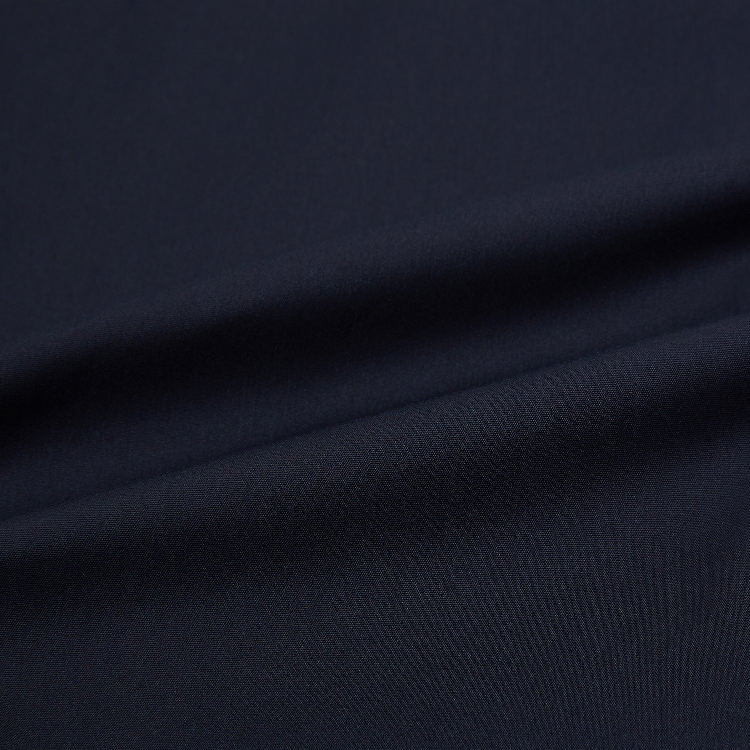 View 8 of product The Navy Westminster Shirt by Turnbull & Asser is a classic long-sleeve, button-up shirt with a pointed collar and buttoned cuffs, exemplifying British craftsmanship, shown against a plain white background.