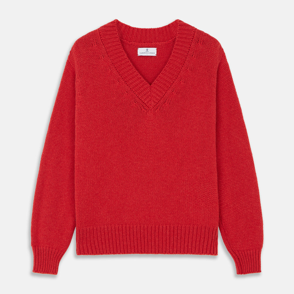 The Turnbull & Asser Raspberry Red Cashmere Edwards V-Neck Sweater features long sleeves, ribbed cuffs and hem, and is shown laid flat on a white background.