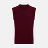 View 1 of product The Turnbull & Asser Burgundy Cashmere Round Neck Vest is a sleeveless jumper with a high crew neckline, shown against a plain white background.