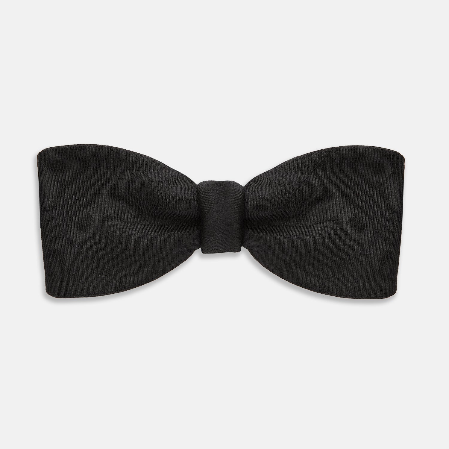 View 1 of product The Casino Royale Shantung Silk Bow Tie by Turnbull & Asser, as seen on James Bond, features a classic shape in black silk and is set against a plain white background—a timeless gentleman’s accessory.