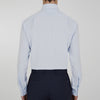 View 6 of product The Turnbull & Asser Two-Fold 120 Light Blue Shirt features a T&A collar, 3-button cuffs, white buttons, front pocket, and inner collar label. It is displayed neatly folded on a plain white background.