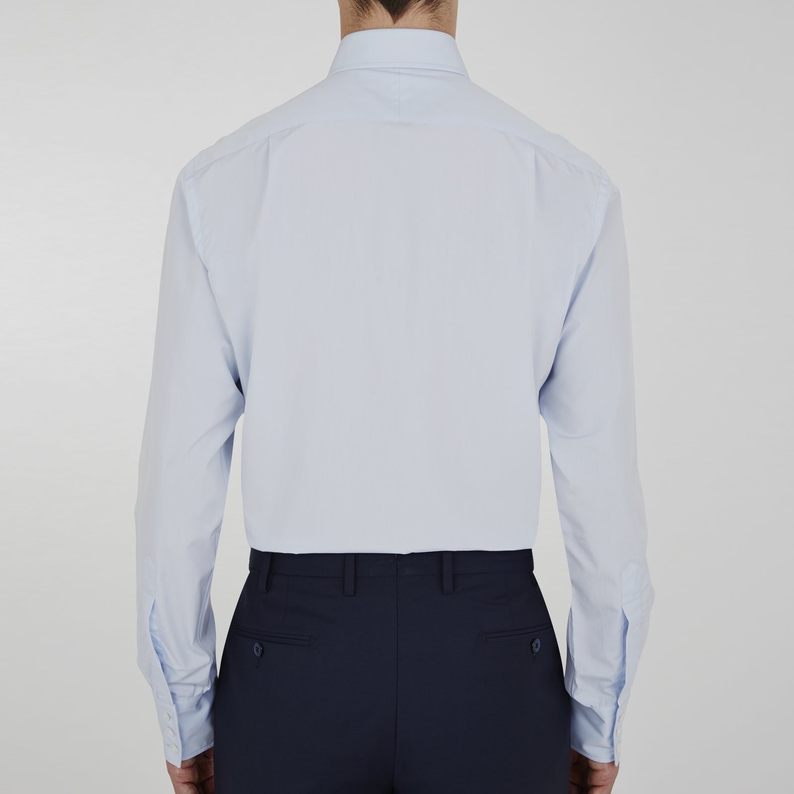 View 6 of product The Turnbull & Asser Two-Fold 120 Light Blue Shirt features a T&A collar, 3-button cuffs, white buttons, front pocket, and inner collar label. It is displayed neatly folded on a plain white background.