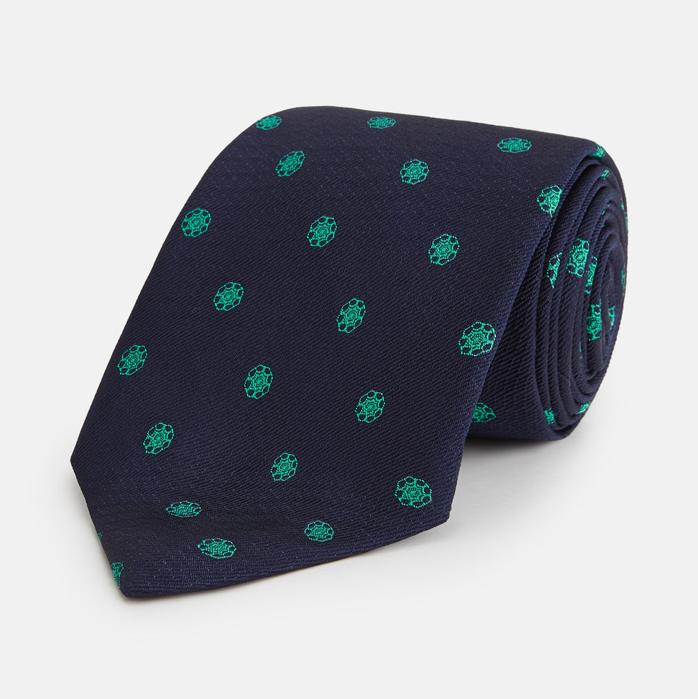 The Green flower and navy silk tie by Turnbull & Asser is perfect for adding a touch of color to any classic wardrobe.
