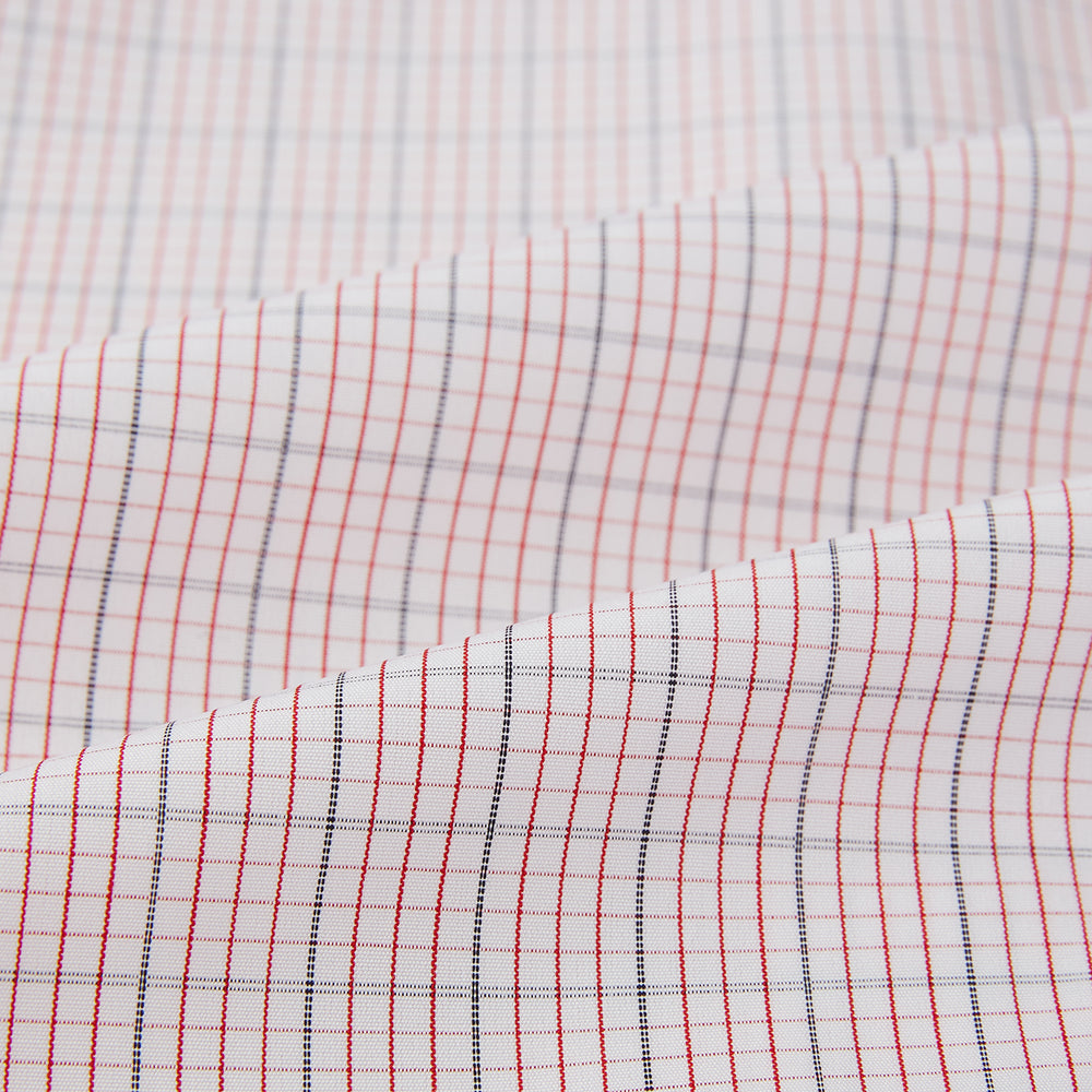 The Turnbull & Asser Red Micro Graph Check Mayfair Shirt is a long-sleeved, button-up Italian cotton shirt with a spread collar and buttoned cuffs, shown on a plain white background.