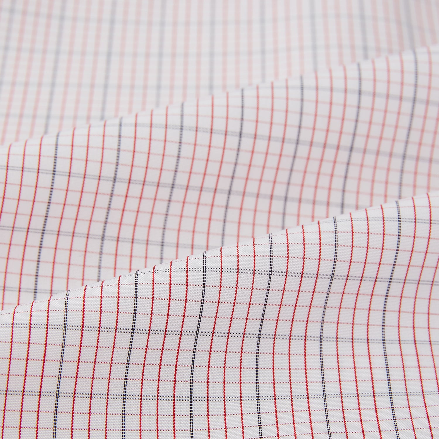 View 5 of product The Turnbull & Asser Red Micro Graph Check Mayfair Shirt is a long-sleeved, button-up Italian cotton shirt with a spread collar and buttoned cuffs, shown on a plain white background.