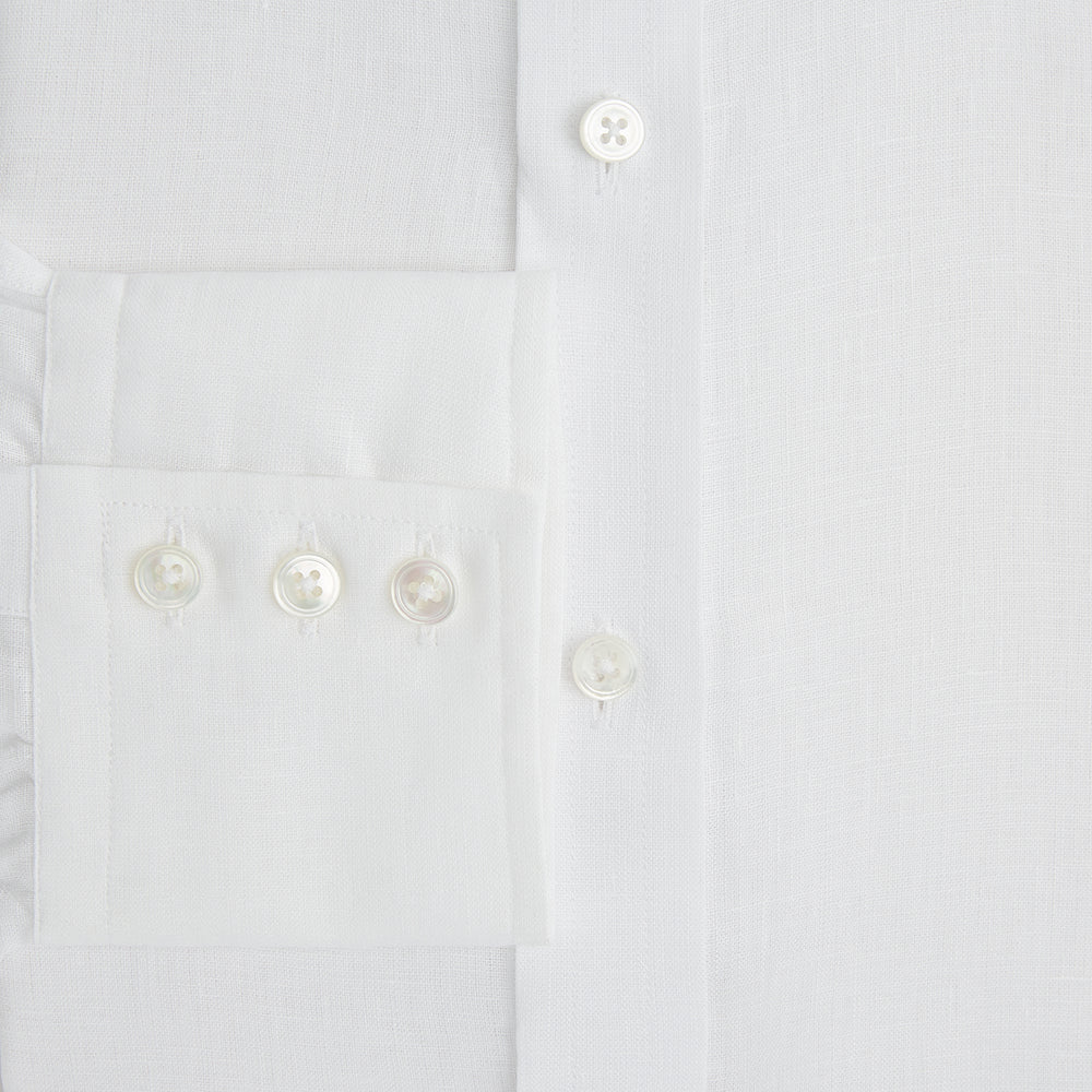 The Turnbull & Asser White Linen Mayfair Shirt features long sleeves and a classic collar, shown on a flat white background.