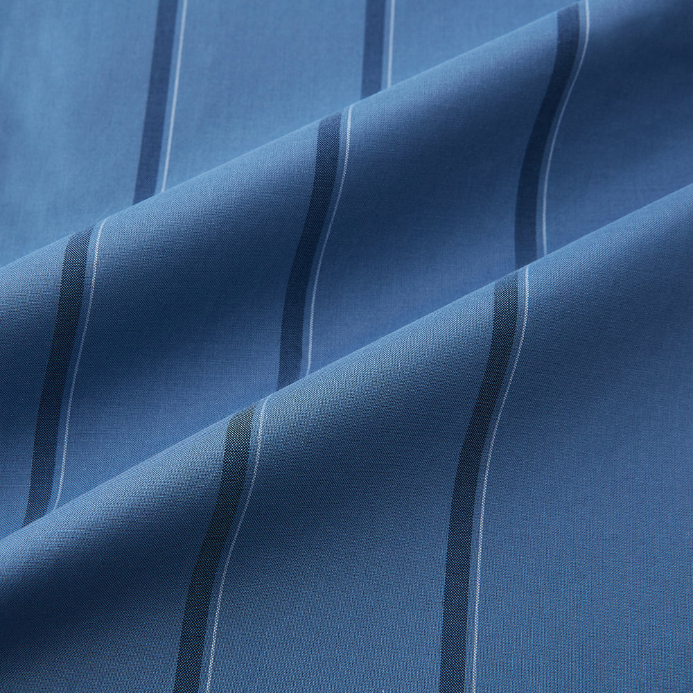 The Turnbull & Asser Steel Grey Track Stripe Shirt features vertical black stripes, a contrast white T&A collar, and white cuffs, shown against a plain light background.