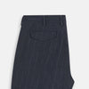View 6 of product The Navy Striped Edmund trousers by Turnbull & Asser have a relaxed, straight-leg fit with front pleats, belt loops, and a single button waist closure, shown against a plain white background.