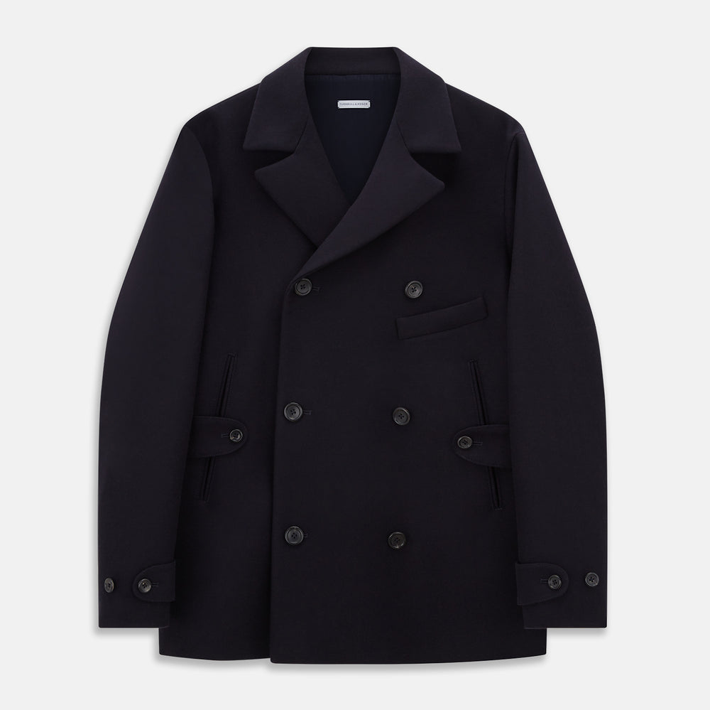 The Turnbull & Asser Navy Wellington Double-Breasted Caban Coat features wide lapels, six front buttons, a chest pocket, and two side pockets with buttoned flaps—ideal for polished formal wear.