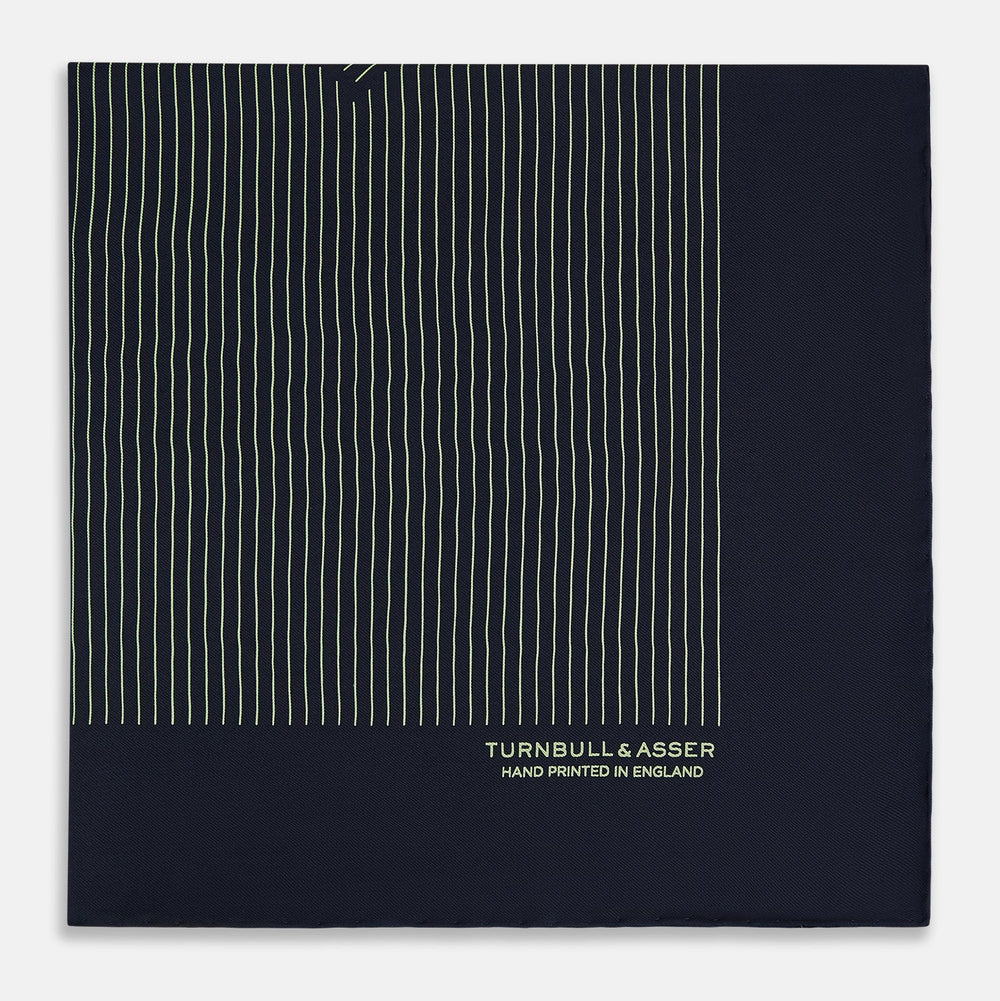 The Navy and Melon Green Stripe Silk Pocket Square by Turnbull & Asser features refined stripes, hand-printed branding in the corner, and is finished with elegant hand-rolled edges.