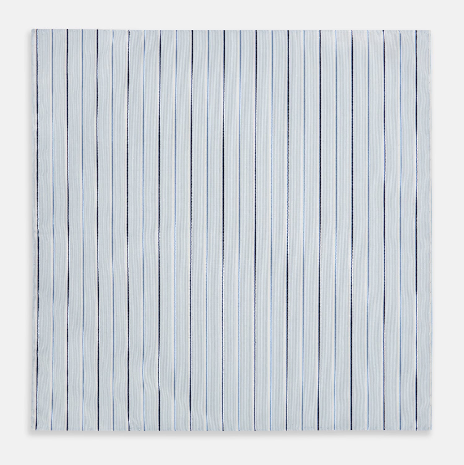 View 1 of product The Turnbull & Asser Navy and Blue Combination Stripe Hand-Rolled Handkerchief features a light blue base with evenly spaced dark blue pinstripes and refined hand-rolled edges, offering a classic, elegant look.