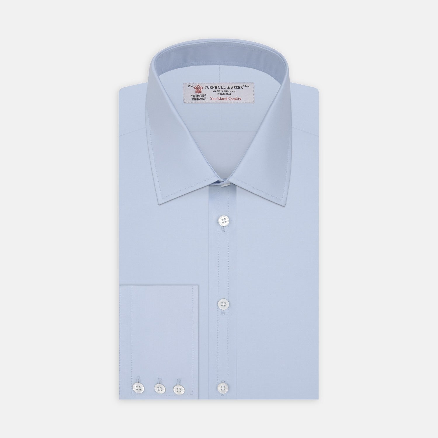 View 2 of product A circular swatch of Turnbull & Asser Light Blue Sea Island Quality Cotton Fabric, subtly textured and bordered by thin gray and white rings, displayed on a plain white background.