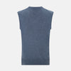 View 3 of product The Avio Blue Cashmere V-neck Vest by Turnbull & Asser is a sleeveless knitwear piece with ribbed hem and armholes, shown against a plain white background.