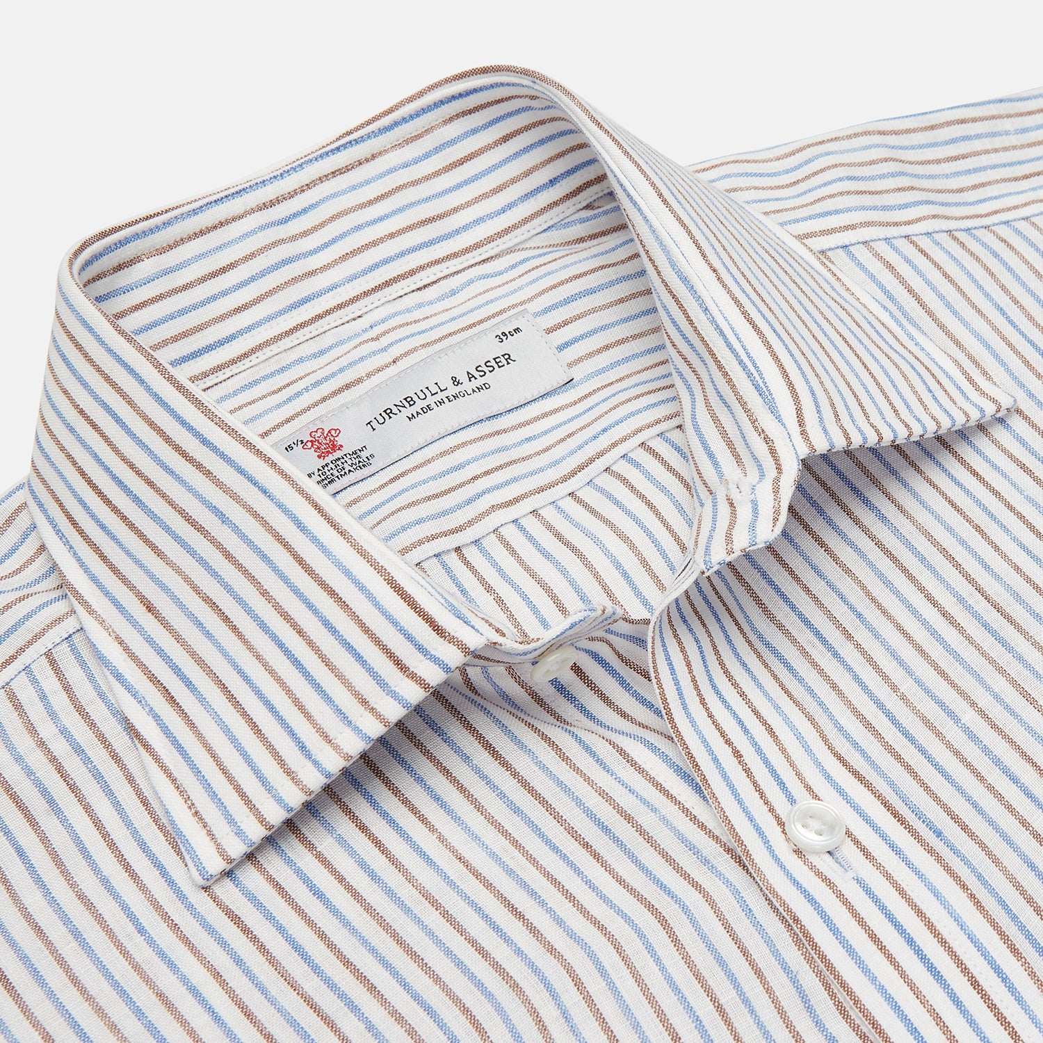 View 3 of product The Turnbull & Asser Brown and Blue Ticking Stripe Linen Shirt features a POW collar and 3-button cuffs, displayed against a light gray surface.
