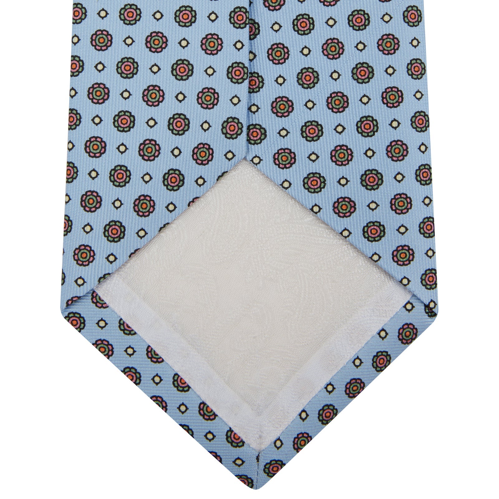 View 4 of product The Great Gatsby Silk Tie by Turnbull & Asser, as seen on Jay Gatsby—a light blue silk tie with red, yellow, and navy geometric floral motifs, ideal for classic 1920s-inspired shirts.