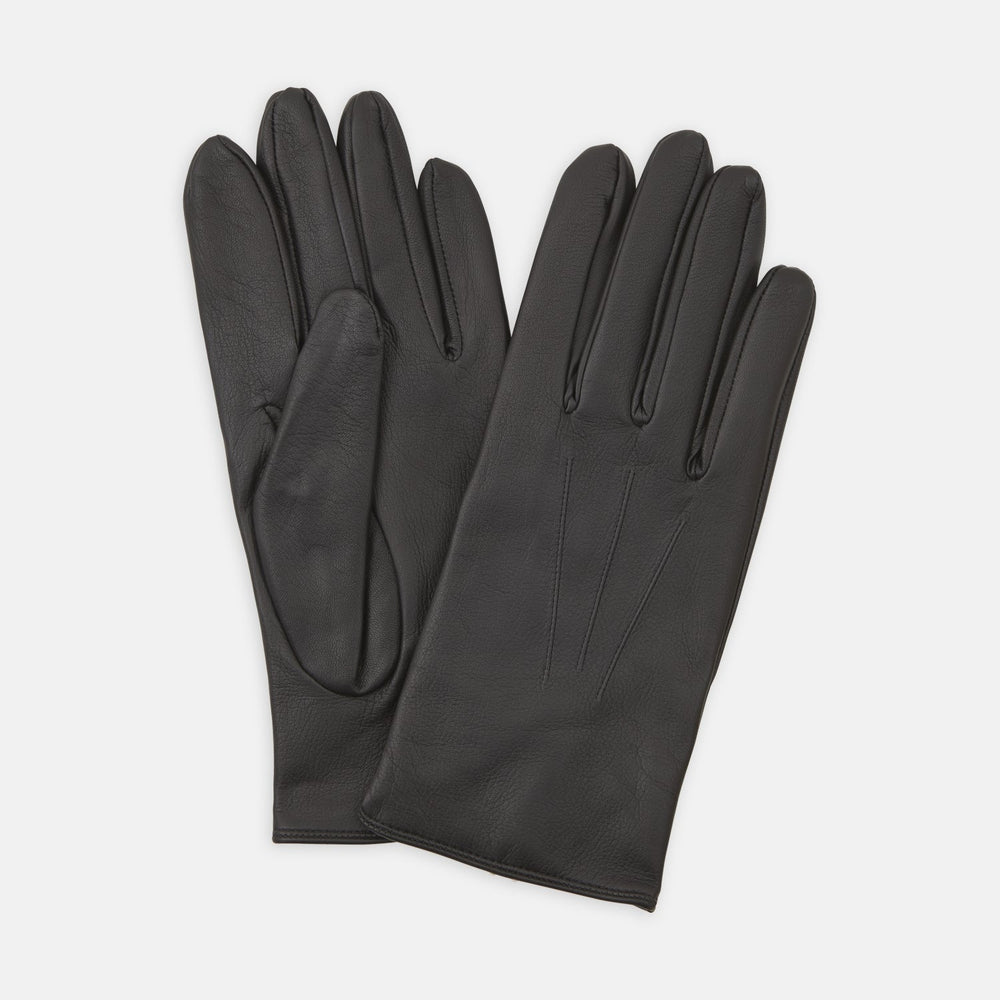 The Berkeley Black Leather Evening Gloves by Turnbull & Asser, one laid flat and the other resting partially on top, are displayed on a white background.