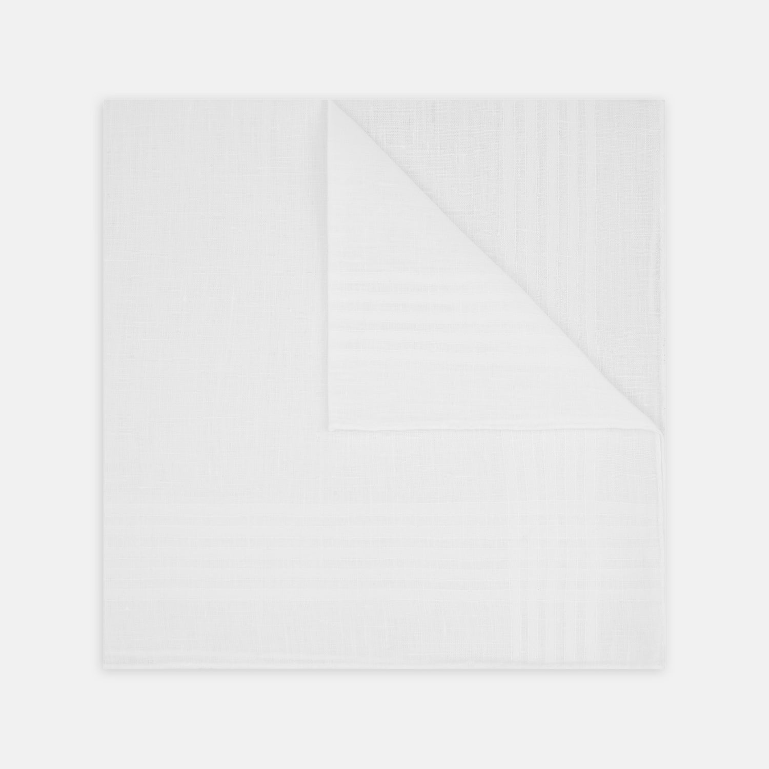 View 1 of product The Turnbull & Asser White Cross Stripe Hand-Rolled Linen Handkerchief, featuring a simple design and lightweight fabric, is neatly displayed with a folded corner—ideal for slipping into a suit pocket and set against a white background.