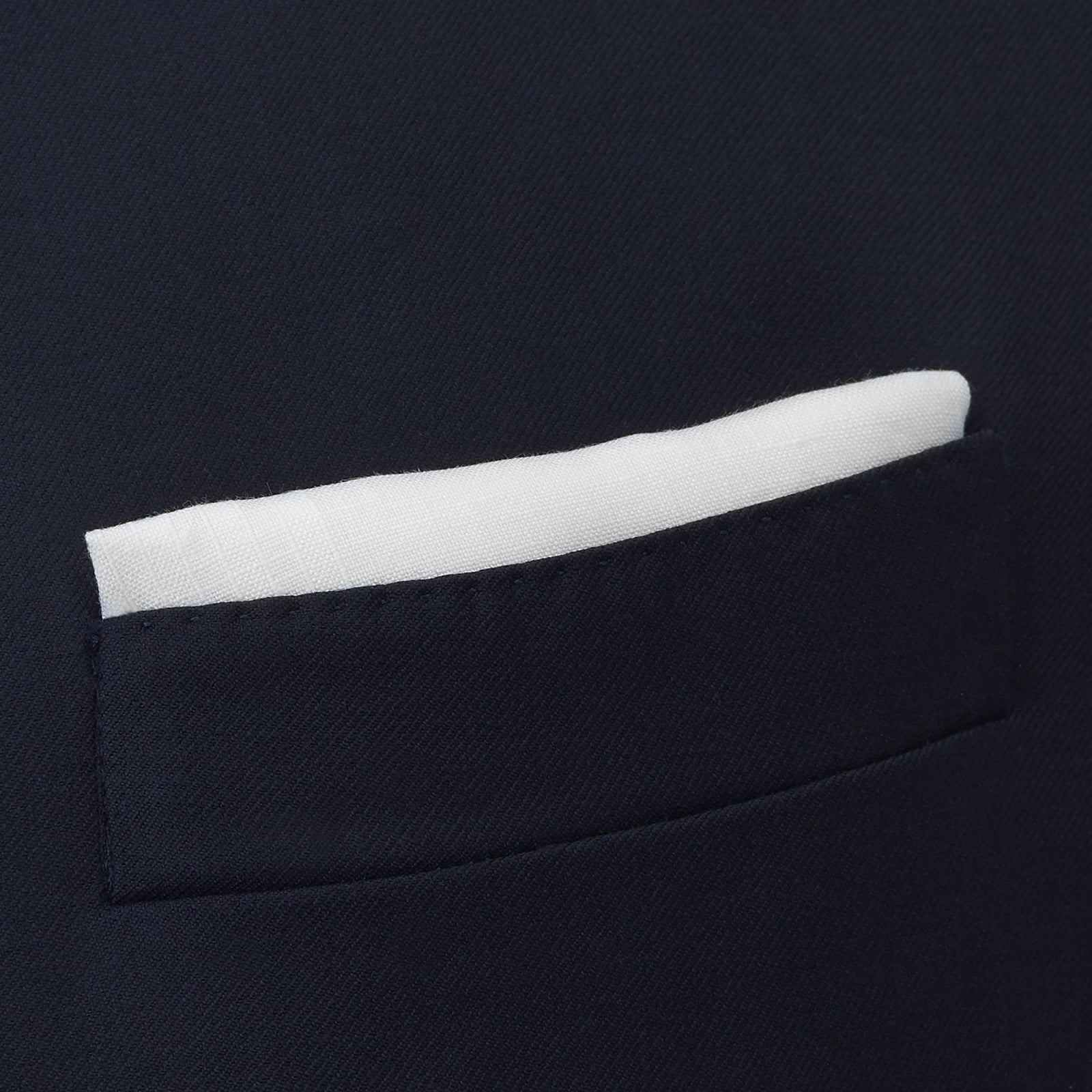 View 4 of product The Turnbull & Asser White Cross Stripe Hand-Rolled Linen Handkerchief, featuring a simple design and lightweight fabric, is neatly displayed with a folded corner—ideal for slipping into a suit pocket and set against a white background.