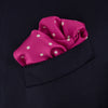 View 4 of product The Fuchsia Spot Silk Pocket Square by Turnbull & Asser features bright fuchsia silk with evenly spaced white spots and the brand’s name in one corner. A classic accessory, it is shown with one corner folded over.