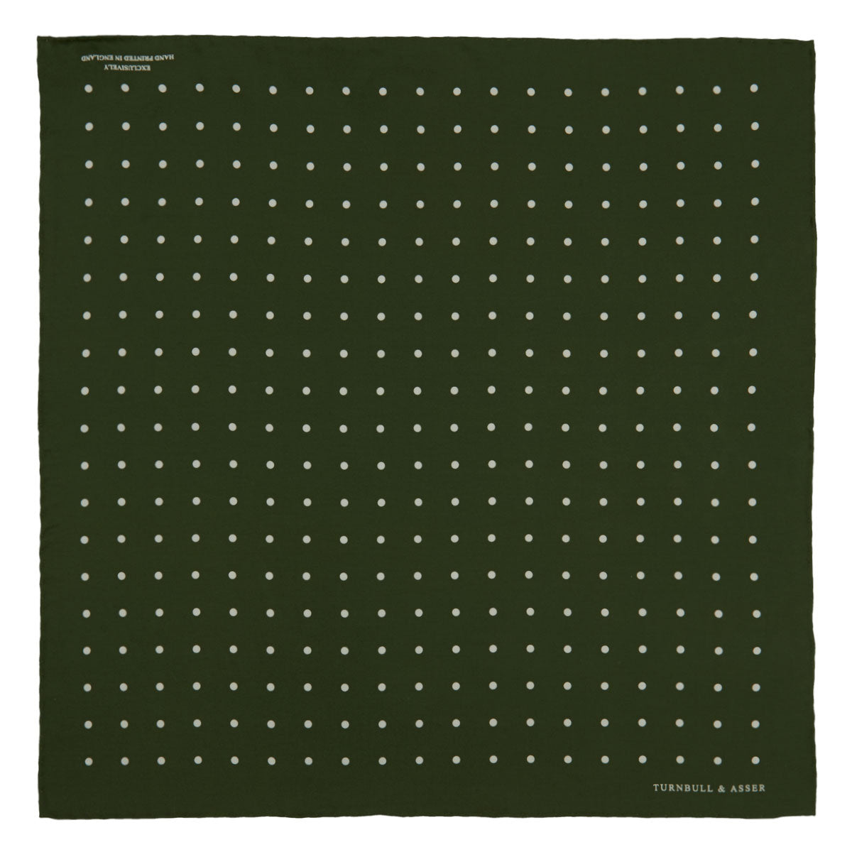 View 2 of product The Turnbull & Asser Olive Spot Silk Pocket Square features white polka dots, the brand’s logo in one corner, and a stylishly folded tip for a dapper finish.
