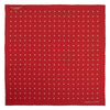 View 2 of product The Red and White Spot Silk Pocket Square by Turnbull & Asser features evenly spaced white polka dots on red silk with the brand's name printed in one corner. A folded edge reveals the reverse of this timeless pocket square.