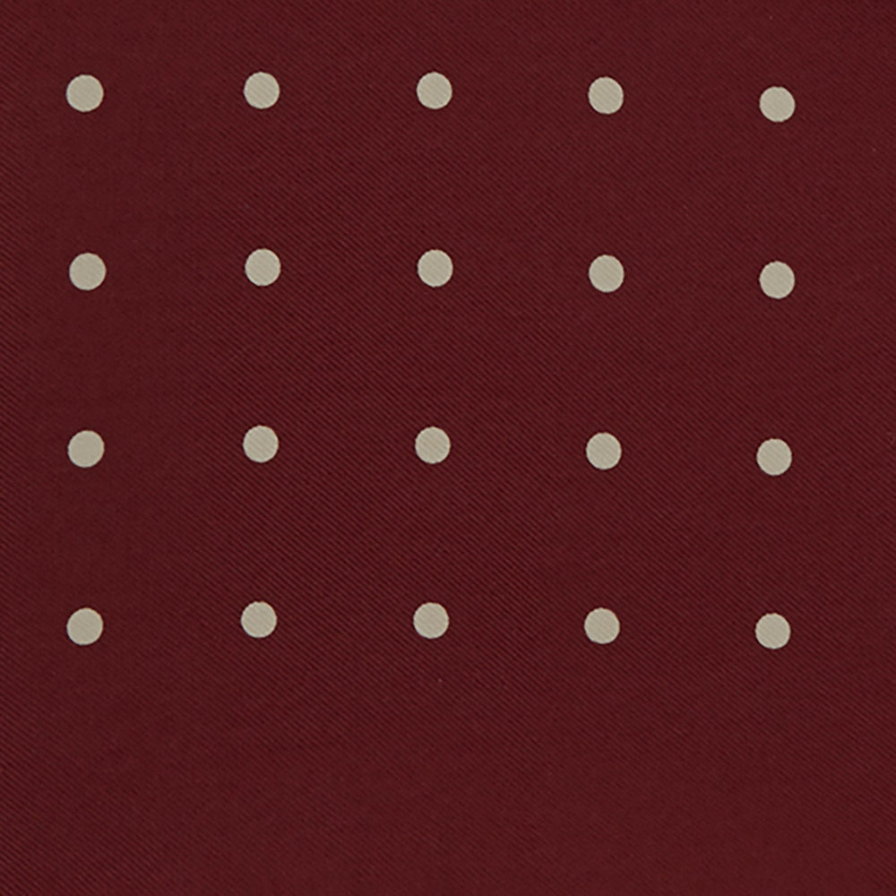 Add a touch of elegance with the Turnbull & Asser Burgundy Spot Silk Pocket Square, featuring white dots, a printed corner logo, and folded edging—a classic men’s accessory for any occasion.