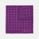 The Turnbull & Asser Purple Spot Silk Pocket Square features white polka dots and a small logo in the corner, with one corner folded over to showcase the underside.