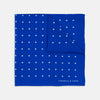 View 1 of product The Bright Blue Spot Silk Pocket Square by Turnbull & Asser features evenly spaced white polka dots and the brand's name printed in white in the bottom right corner, making it a stylish accessory for any suit.