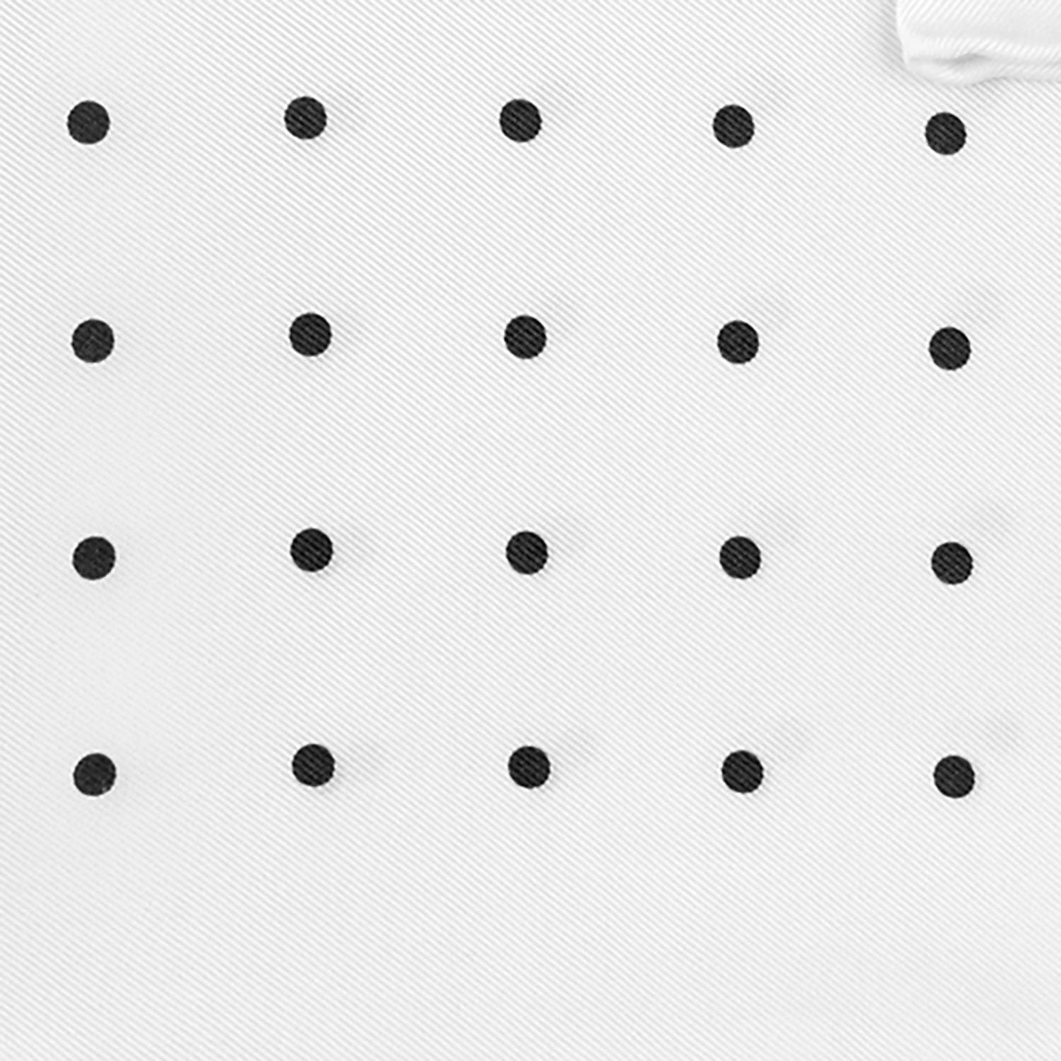 View 3 of product The Turnbull & Asser White and Black Spot Silk Pocket Square for men features evenly spaced black dots, a partial corner fold, and the brand name printed in black in the lower right corner.