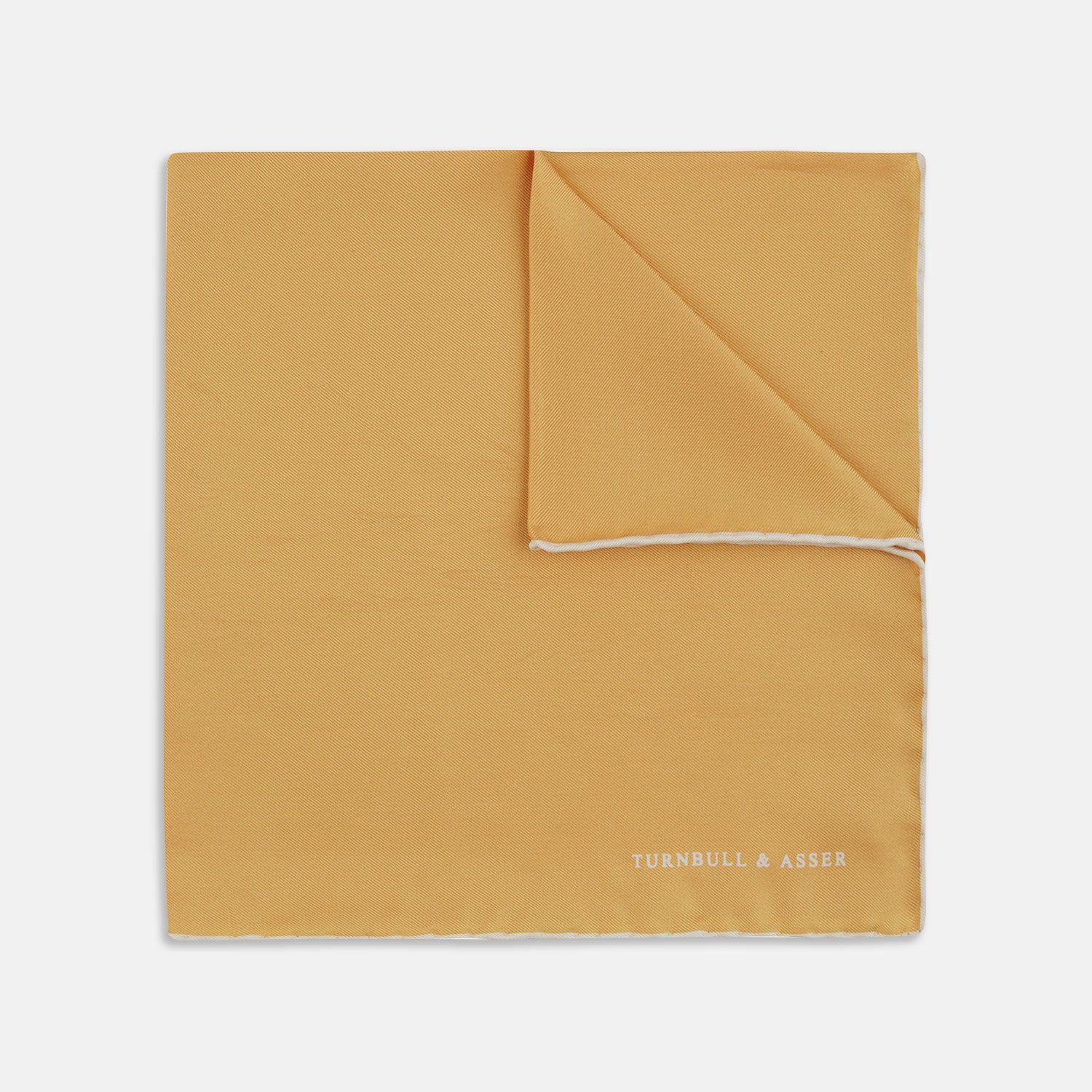View 1 of product The Gold and White Piped Silk Pocket Square by Turnbull & Asser features neat white edging and TURNBULL & ASSER printed in one corner—a timeless silk accessory for any wardrobe.