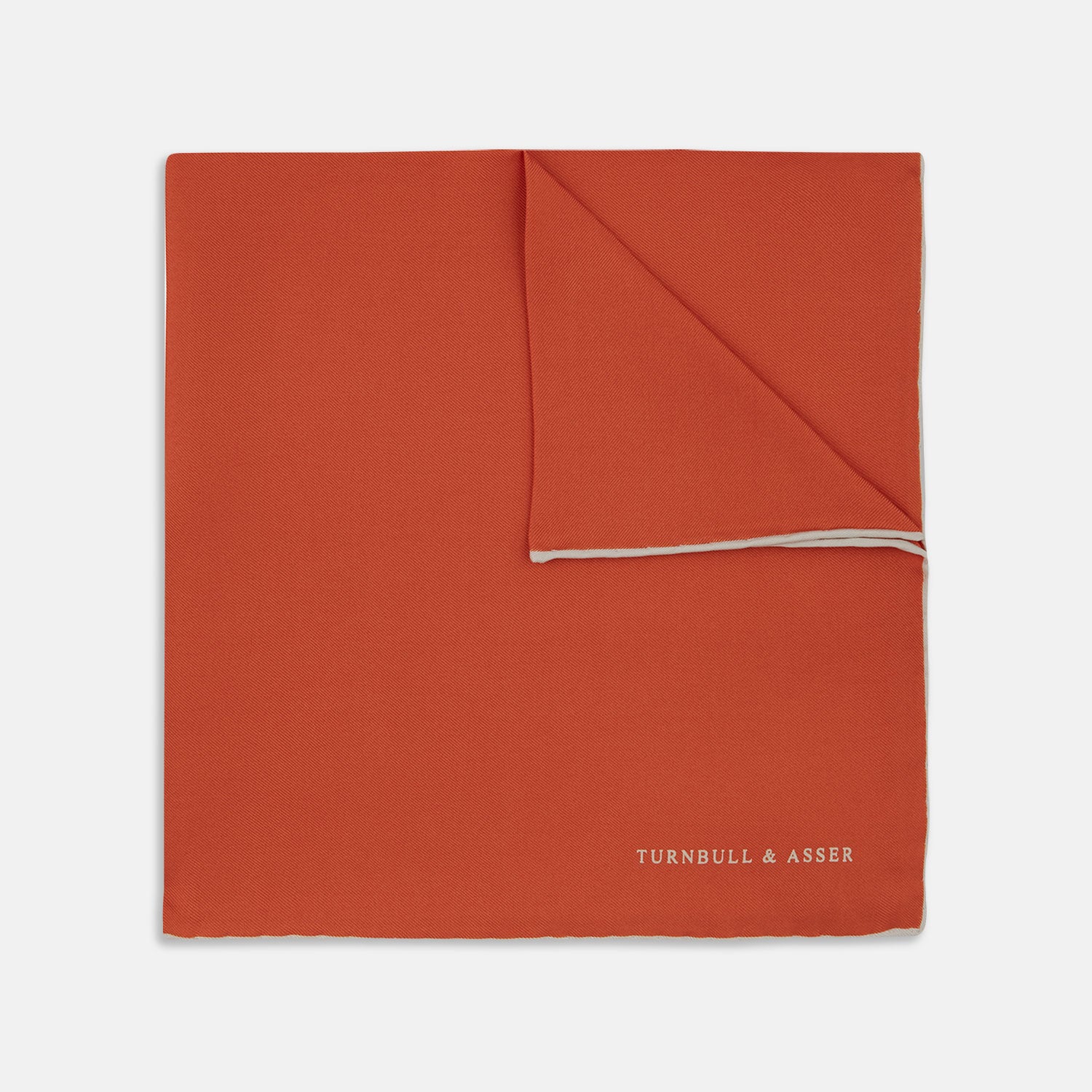 View 1 of product A classic men's accessory, the Turnbull & Asser Dark Orange and White Piped Silk Pocket Square adds a timeless touch to any look.