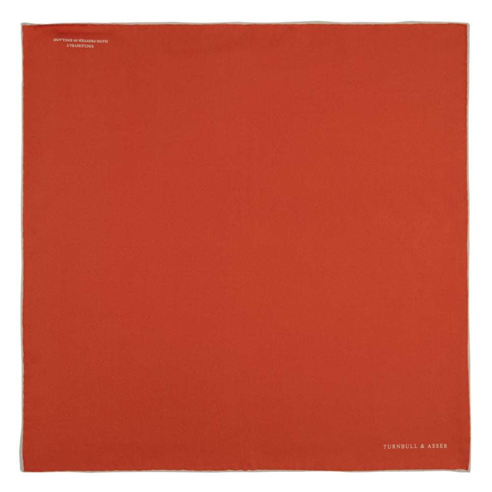 A classic men's accessory, the Turnbull & Asser Dark Orange and White Piped Silk Pocket Square adds a timeless touch to any look.