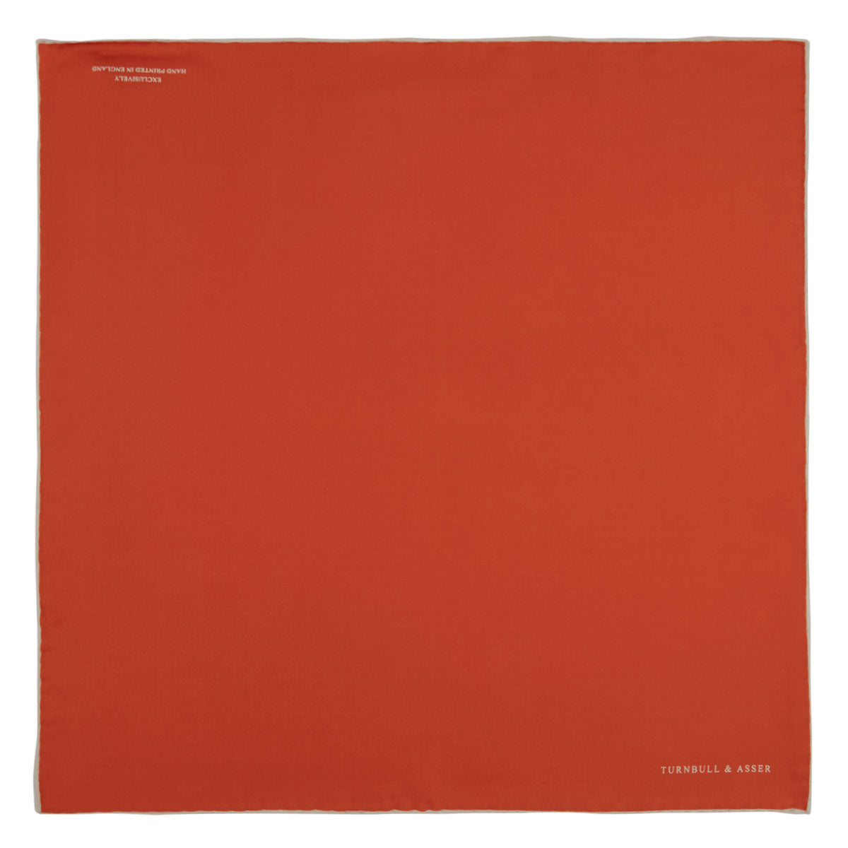 View 2 of product A classic men's accessory, the Turnbull & Asser Dark Orange and White Piped Silk Pocket Square adds a timeless touch to any look.