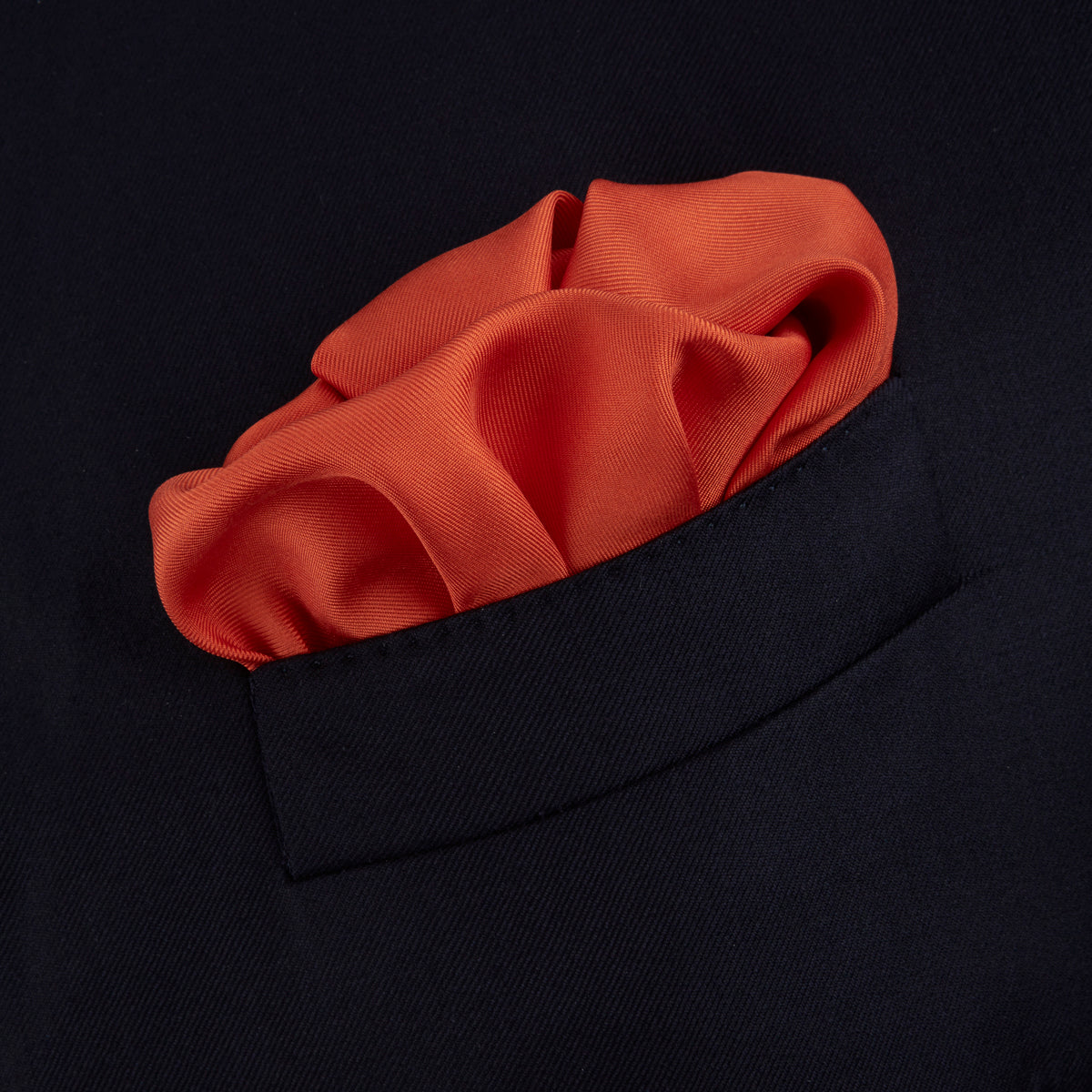 View 4 of product A classic men's accessory, the Turnbull & Asser Dark Orange and White Piped Silk Pocket Square adds a timeless touch to any look.
