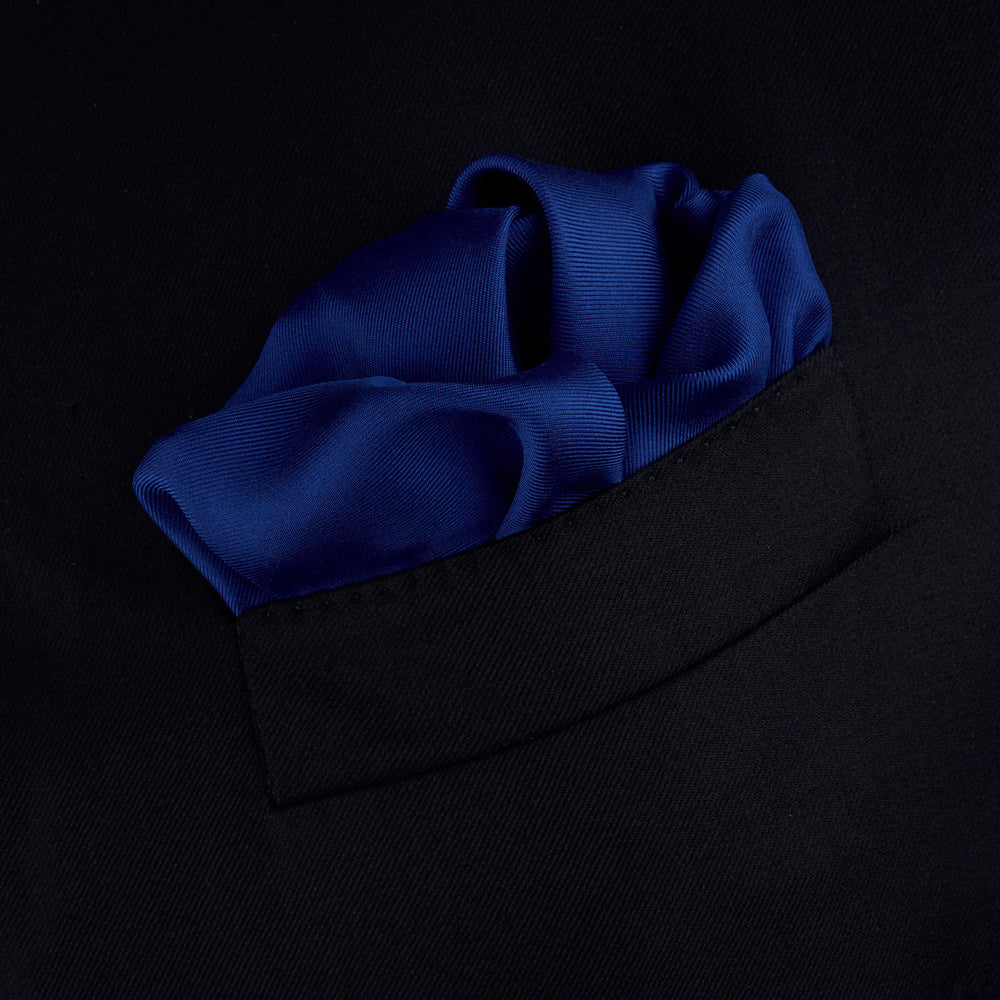 A Dark Blue Piped Silk Pocket Square by Turnbull & Asser, neatly folded with white edging and the brand's logo in one corner, displayed on a plain white background.